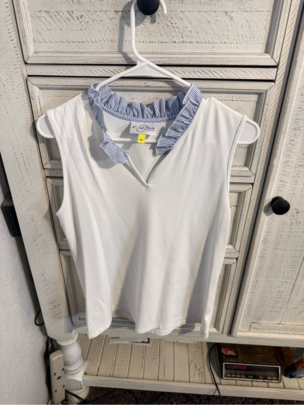 Sleeveless White Ruffle-Trim Blouse with Blue Stripe Collar